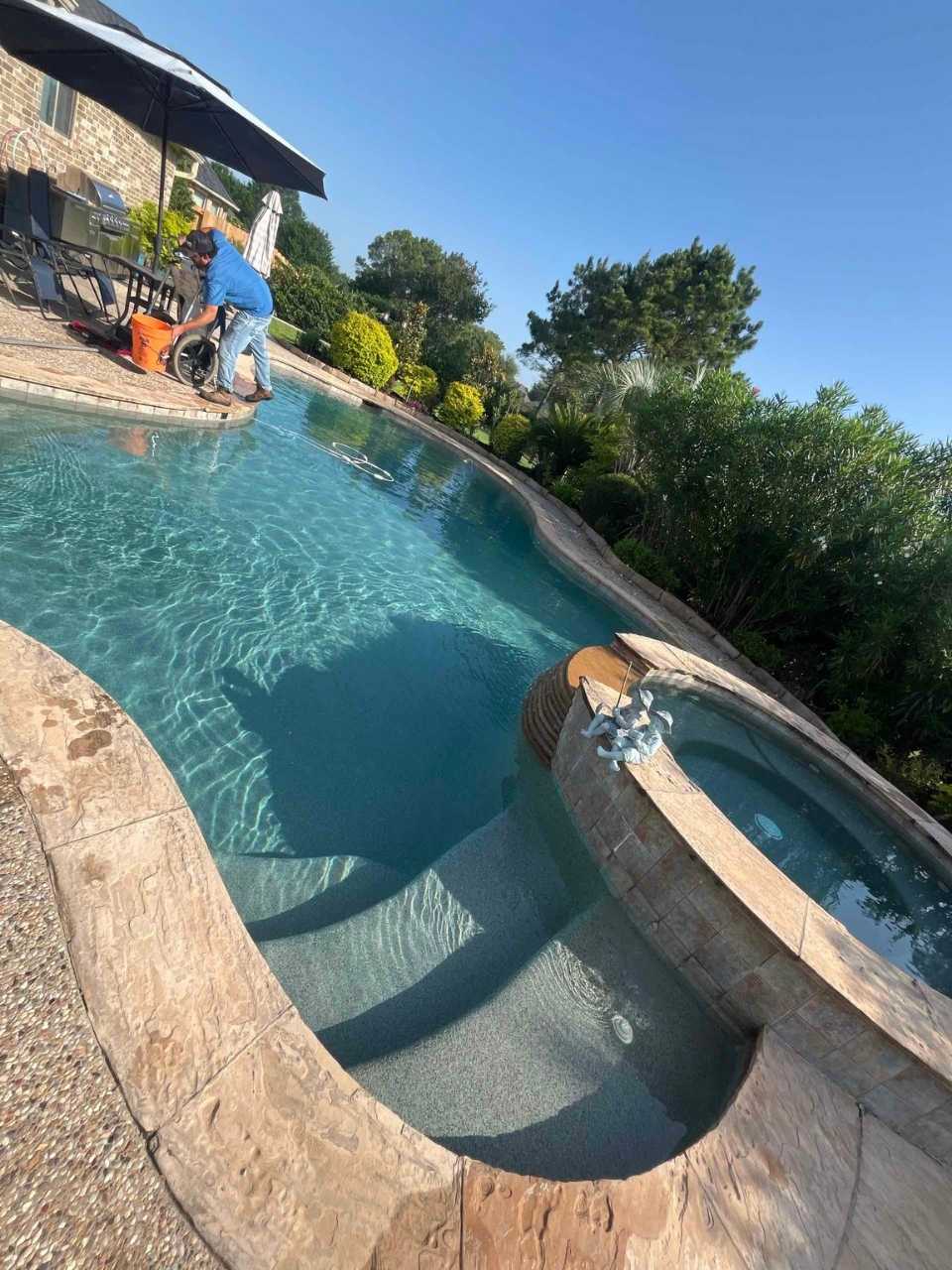 A pool in Katy, TX being cleaned