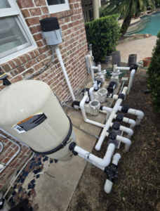 Pool repair specialist repairing residential swimming pool in Sugar Land TX