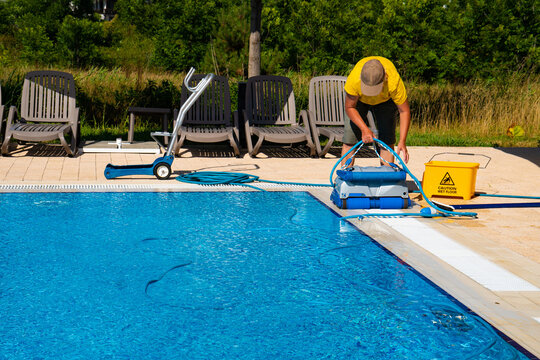 ACORB Pools technician removing pool filter for maintenance