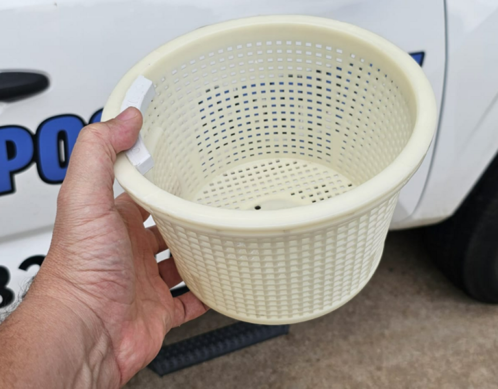 Pool technician performing thorough pool filter cleaning in Sugar Land